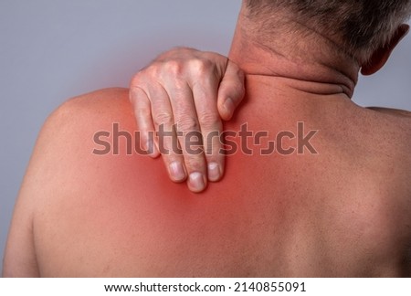 Trigger points pain. Ache in back, pressure in scapula close up. High quality photo
