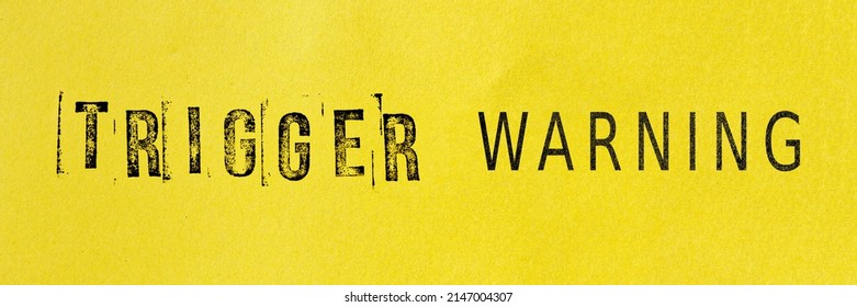 Trigger Warning Sign Message On Yellow Background. Stamp Letters Mental Triggering Concept.