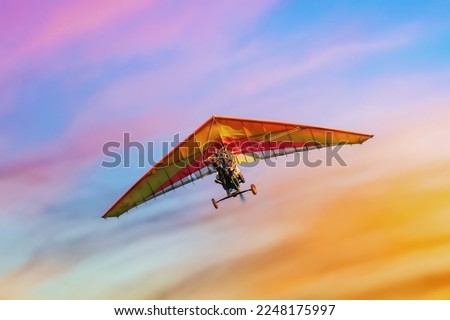 trike in flight on the background of colorful sunset sky