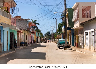 TRINIDAD - CUBA / 03.10.2015: Street Scene In Trinidad With Overhead Electrical Cables, Chaotic Electrical Installations And Classic Car, Cuba