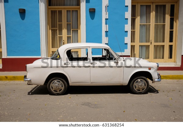 TRINIDAD, CUBA - CIRCA APRIL 2017: Classic car\
parked in the streets of Trinidad. Recent changes in law made by\
Raul Castro allows Cubans to trade cars again.Cuba has about 60.000\
old american cars.
