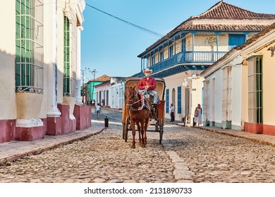 Trinidad, Cuba - February 12, 2022: Horse-drawn Transport On Cobblestone Street In Colonial Old Town. Transport, Travel Concept.