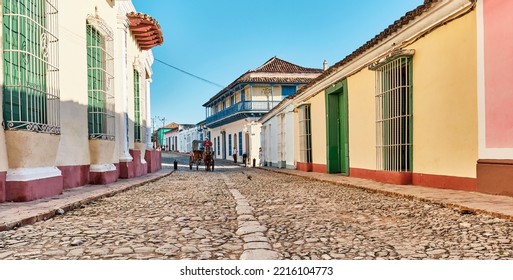 Trinidad, Cuba - February 12, 2022: Cobblestone Street In Colonial Old Town. Cabman On Horse-drawn Cart. Transport, Travel Concept.Banner