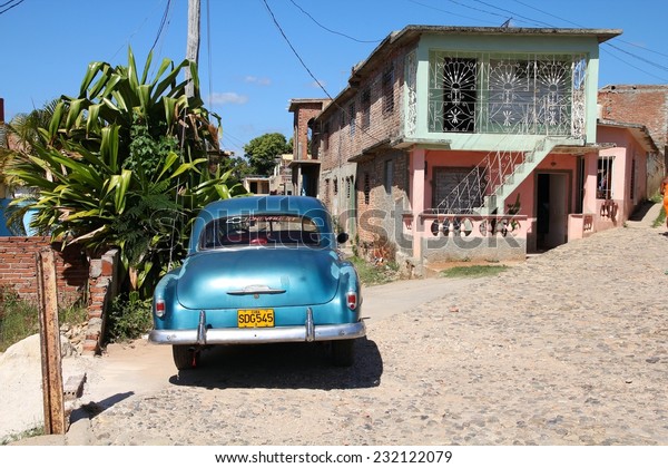 TRINIDAD, CUBA - FEBRUARY 6,\
2011: Oldtimer American car parked in the street in Trinidad. Cuba\
has one of the lowest car-per-capita rates (38 per 1000 people in\
2008).