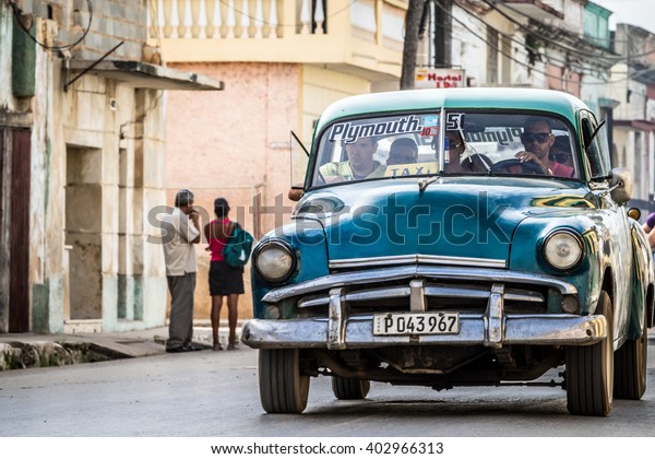 TRINIDAD, CUBA - JUNE 19,\
2015: Cuban peoples drives in the american classic car in Trinidad\
Cuba - HDR