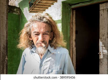 TRINIDAD, CUBA - NOVEMBER 5, 2015: Portrait Of Mature Man Of Creole Ethnicity Smoking Cigar