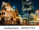 Trinity Church and the John Hancock Tower at night, at Copley Square, in Back Bay, Boston, Massachusetts.