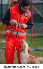 TRINO VERCELLESE, ITALY- MARCH 10: Civil Defense During Dog Handling On March, 10, 2012 In Trino Vercellese, Italy. Rescue Workers Trained Dogs To Search And Save Missing Person