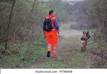 TRINO VERCELLESE, ITALY- MARCH 10: Civil Defense During Dog Handling On March, 10, 2012 In Trino Vercellese, Italy. Rescue Workers Trained Dogs To Search And Save Missing Person