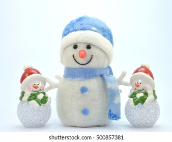 Trio of snowman with a glass ball. - Powered by Shutterstock