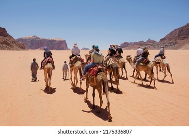 Trip on camels on Wadi Rum Desert in Jordan. The amazing Wadi Rum desert with Martian scenery.