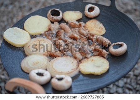 Tripe and vegetables cooked on a griddle