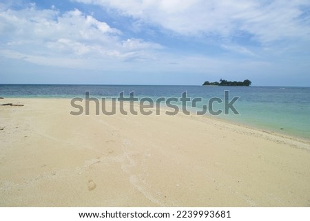 Tripical Beach, Wave and Blue Sea Water. This photo was taken on one of the tropical islands in Kotabaru, Indonesia.