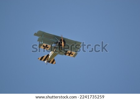  Triplane in flight with blue sky