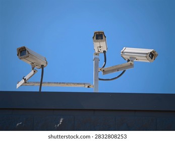 A Triple Camera Array on the Rooftop Big Brother is Watching Surveillance and Security 