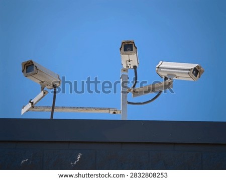A Triple Camera Array on the Rooftop Big Brother is Watching Surveillance and Security 