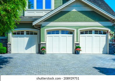 Triple Doors Garage With Wide Long Driveway.