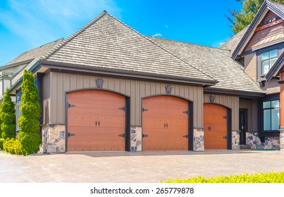 Triple Doors Garage With Wide Long Driveway.