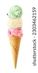 Triple scoop ice cream cone isolated on a white background. Strawberry, vanilla and mint flavors in a waffle cone.
