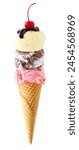 Triple scoop ice cream cone with cherry on top isolated on a white background. Vanilla, chocolate heavenly hash and strawberry flavors in a waffle cone.