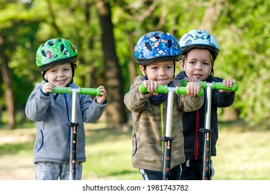 Triplets Boys, Compete In Riding Scooters, Outdoor In The Park