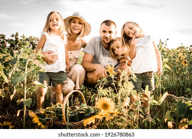 Triplets Sisters In The Field With Mom And Dad