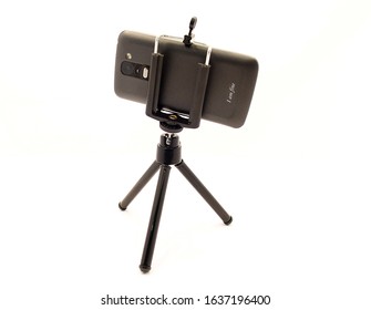 Tripod And Smartphone Isolated On White Background.