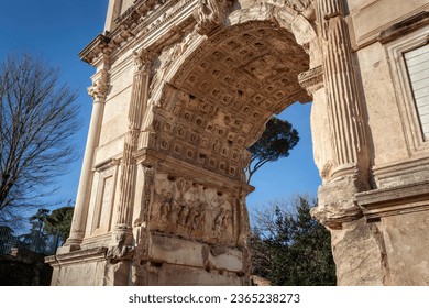 The Triumphal arch of Roman emperor Titus with relief of the Menorah and the Ark of the Covenant on Forum Romanum in Rome, Italy