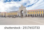 Triumphal arch at Rua Augusta at Commerce square timelapse hyperlapse in Lisbon, Portugal. Cloudy sky. After the great 1775 Lisbon earthquake earthquake the square was completely remodeled.