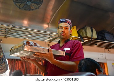 TRIVANDRUM, KERALA, INDIA, APRIL 05, 2016: Indian Railways - Seller Of Snacks On The Train. A Young Man Holding A Tray Of Food Items In The Parasuram Express. Incredible India.