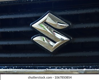 TRIVANDRUM, KERALA, INDIA, APRIL 13, 2018: Close-up Of The Logo Of Maruti Suzuki On The Grill Of Its Swift Dzire Model Car, On A Rainy Day. Atmanirbhar Bharat. Make In India.