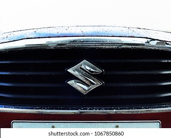 TRIVANDRUM, KERALA, INDIA, APRIL 13, 2018: Close-up Of The Logo Of Maruti Suzuki On The Front Grill Of Its Swift Dzire Model Car, On A Rainy Day. Atmanirbhar Bharat. Make In India.