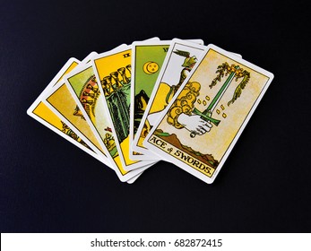 TRIVANDRUM, KERALA, INDIA, JULY 23, 2017: Tarot Prediction. Seven Tarot Cards Spread On Black Background, Flat Lay View.