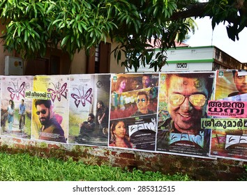 TRIVANDRUM, KERALA, INDIA, JUNE 07, 2015: Movie Posters Stuck On The Compound Wall Of A House By The Roadside. Actors Of Malayalam And Tamil Cinema Nivin Pauly And Surya Are Seen In The Wall Posters. 