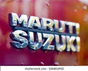 TRIVANDRUM, KERALA, INDIA, MARCH 29, 2018:  Shiny Emblem Of Maruti Suzuki Car On A Red Car After The Rains. Selective Focus. Atmanirbhar Bharat. Make In India.