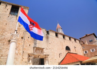 Trogir town walls and flag of Croatia. Architecture of Trogir, Croatia.