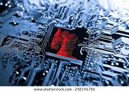 Trojan horse / symbol of a red trojan horse on blue computer circuit board background 