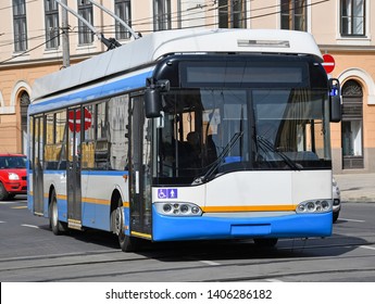 Trolley Bus On The Street Of The City