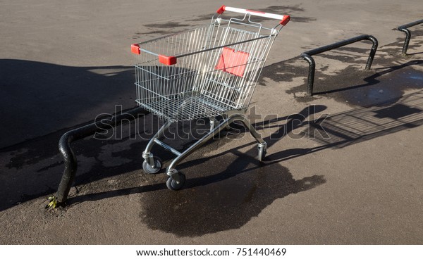 Trolley\
for products in the car park near the\
supermarket