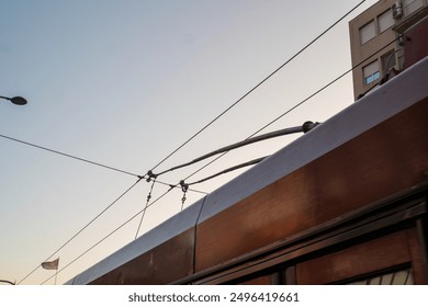 Trolleybus horns on wires isolated against the sky. High quality photo - Powered by Shutterstock