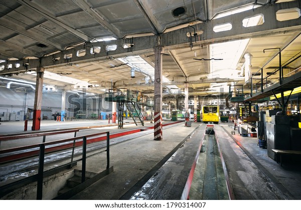 Trolleybuses parked at the trolley depot\
hangar for technical inspection, depot\
maintenance