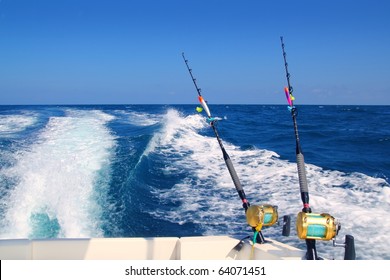 Trolling Fishing Boat Rod And Golden Saltwater Reels Deep Blue Ocean Sea Wake