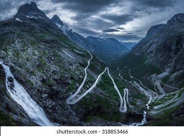 Trollstigen, Norway. The World Famous Curvy Road Of Trollstigen With A Cloudy Sky On The Background.