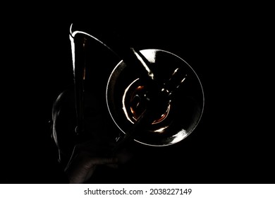 Trombone Player. Trombonist Playing Jazz Musician. Man Playing Trumpet Brass Instruments In Darkness Isolated On Black Background