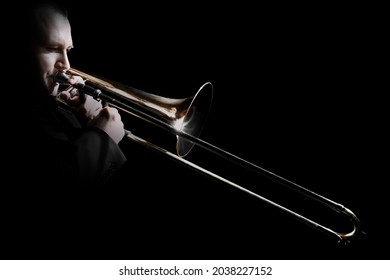 Trombone Player. Trombonist Playing Jazz Musician. Orchestra Trumpet Brass Instruments Isolated On Black