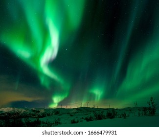 Tromso, Norway - 02 29 2020: northernlights dancing near Tromso at the nightsky