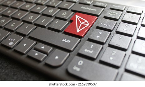 Tron (trx) coin icon labeled keyboard key.