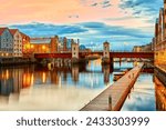Trondheim view of the river Nidelva and the bridge Bakke Bru at summer sunset, Norway