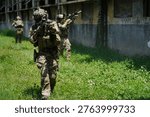 Troops practice maneuvers in a rugged setting, showcasing teamwork and discipline