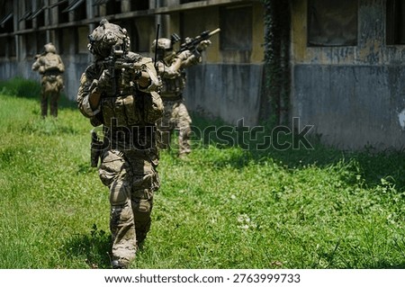 Troops practice maneuvers in a rugged setting, showcasing teamwork and discipline